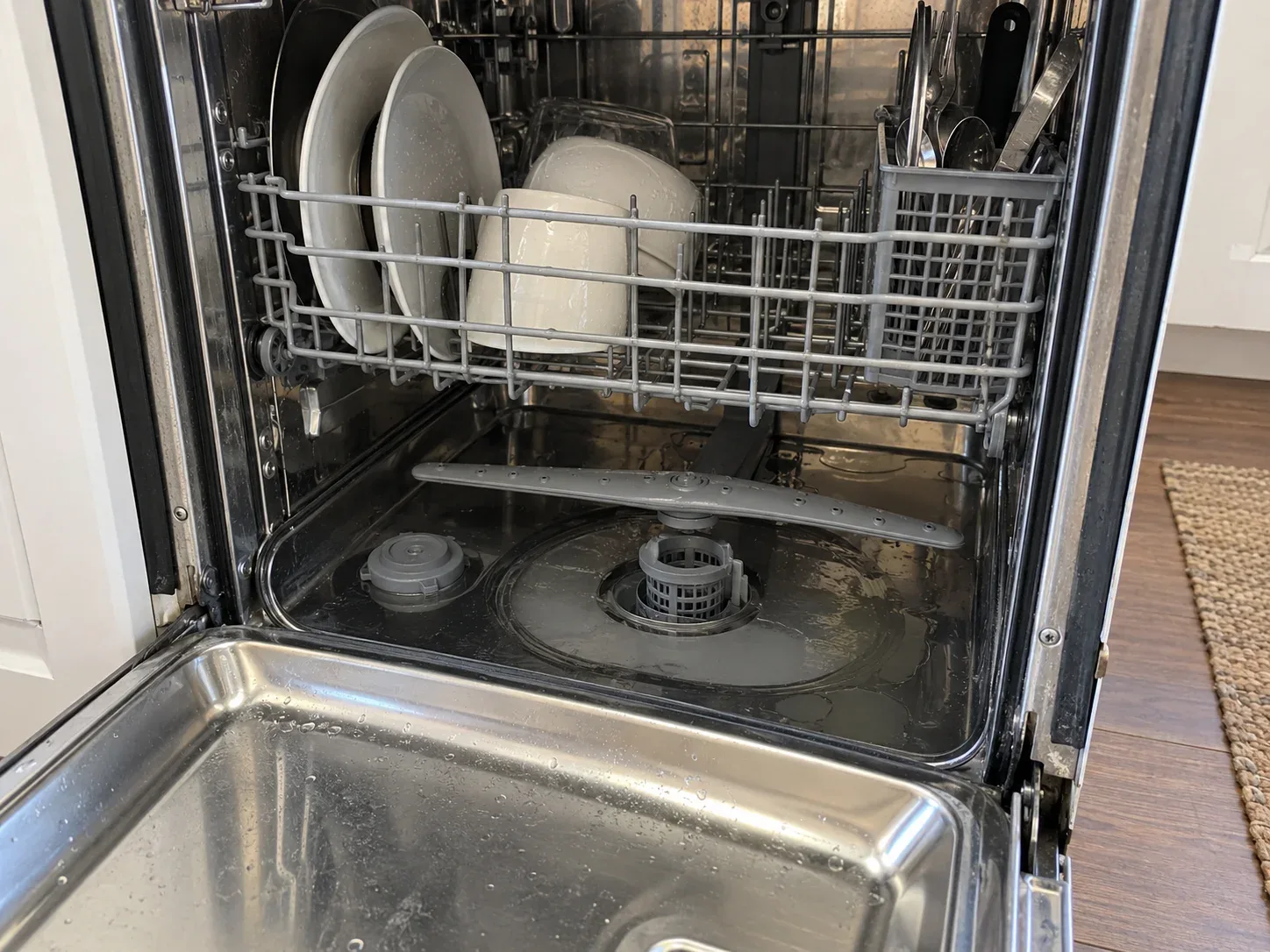 Open dishwasher in a home kitchen